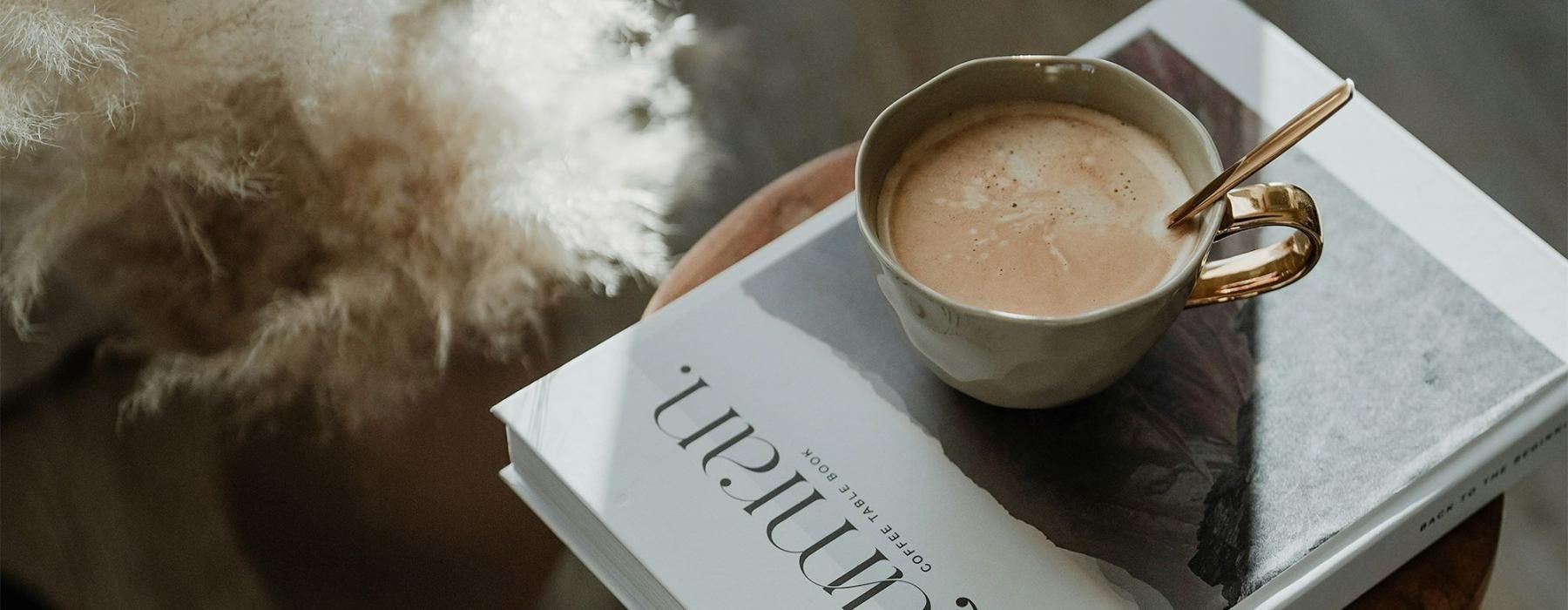 a cup of coffee on a book