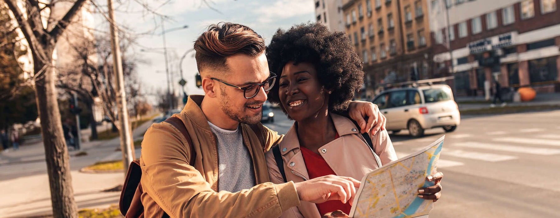 two people walking with a map