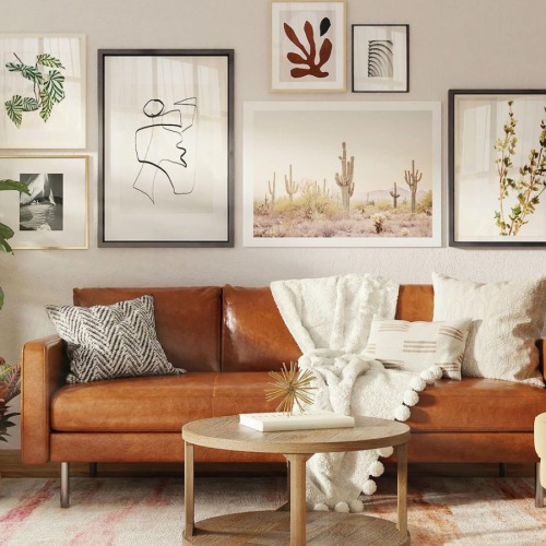 a living room with a couch and a plant